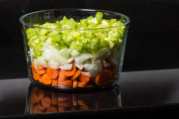 Bowl of chopped vegetables on counter