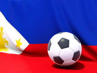 Fototapeta premium Flag of philippines with football in front of it