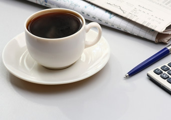 Cup of coffee near press