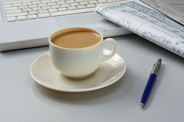 Cup of coffee near press