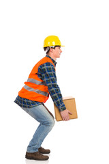 Crouching with a heavy package.