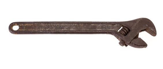 Old and rusty spanner isolated on white