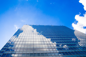 Obraz na płótnie Canvas Abstract building. blue glass wall of skyscraper