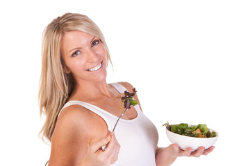 A healthy woman with salad on white background