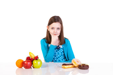 a young girl making a healthy versus junk food decision