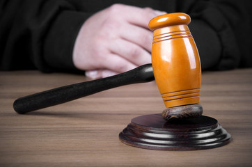Referee hammer and a man in judicial robes