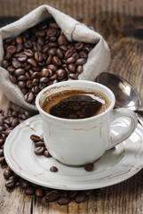 Cup of coffee on wooden table