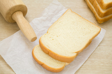 Fototapeta na wymiar Sliced bread on baking paper