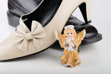 Male and female shoes with a sweet little angel for Saint Valentine Day, the day of the lovers