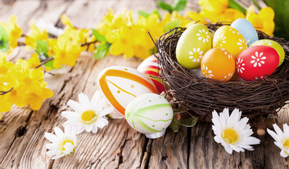 Easter colored eggs on wood