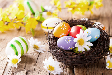 Easter colored eggs on wood