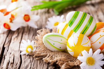 Easter colored eggs on wood
