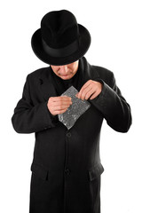 Man is popping bubble wrap sheet