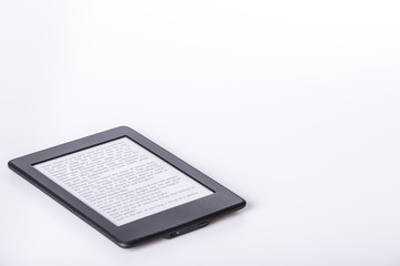 black ebook reader or tablet on white background
