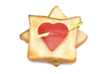 Toast with heart-shaped Paprika isolated on white