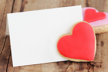 Valentine's greeting card with homemade heart shaped cookies - obrazy, fototapety, plakaty