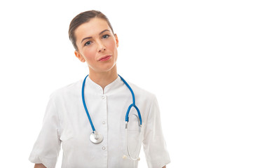 Woman doctor with stethoscope standing over white background