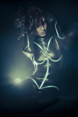 Future women concept, black latex with neon lights