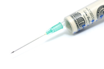 Money in syringe on white background