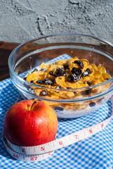 healthy breakfast: cornflakes , Apples ,  raisin with milk