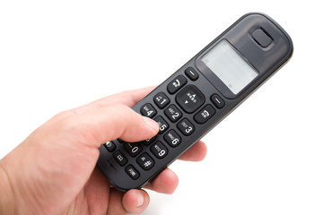 man dialing a wireless telephone with clipping path