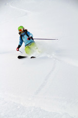 Skier in deep powder, extreme freeride