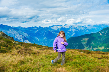 Cute little girl in mountains