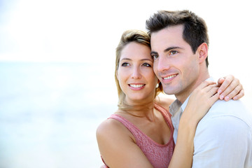 Fototapeta premium In love couple embracing by the beach