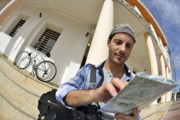 Adventurer looking at street map