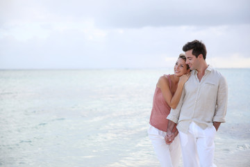 Couple enjoying sunset time at the beach