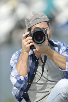 Portrait of photographer taking picture