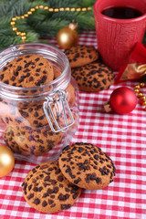 Delicious Christmas cookies in jar on table close-up