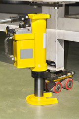 Fototapeta premium hydraulic floor jack lifting, closeup