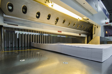 Lower view of a modern paper guillotine with touch screen