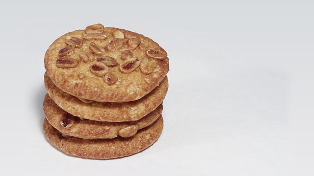 Cookies on white turning close up