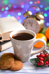 Composition of book with cup of coffee and Christmas