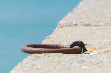 rusty metal boat hooks on a dock
