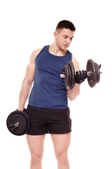 Handsome man working out with dumbbells