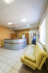 The reception with leather sofa in a modern office building