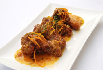 fried chicken thigh admixed sweet  orange sauce