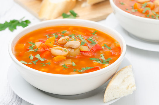 Vegetable soup with white beans in a bowl horizontal