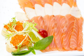 cutting of the fish on the table in a restaurant