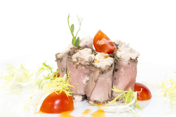 meat rolls with cheese decorated with tomato