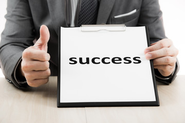 Obraz premium Businessman showing text success