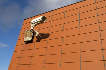 Surveillance camera on a wall.