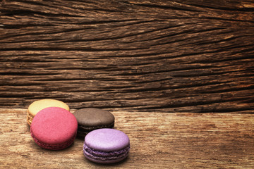 Obraz na płótnie Canvas Macaron dessert on the wood background