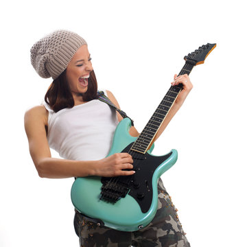 Beautiful young woman playing a guitar