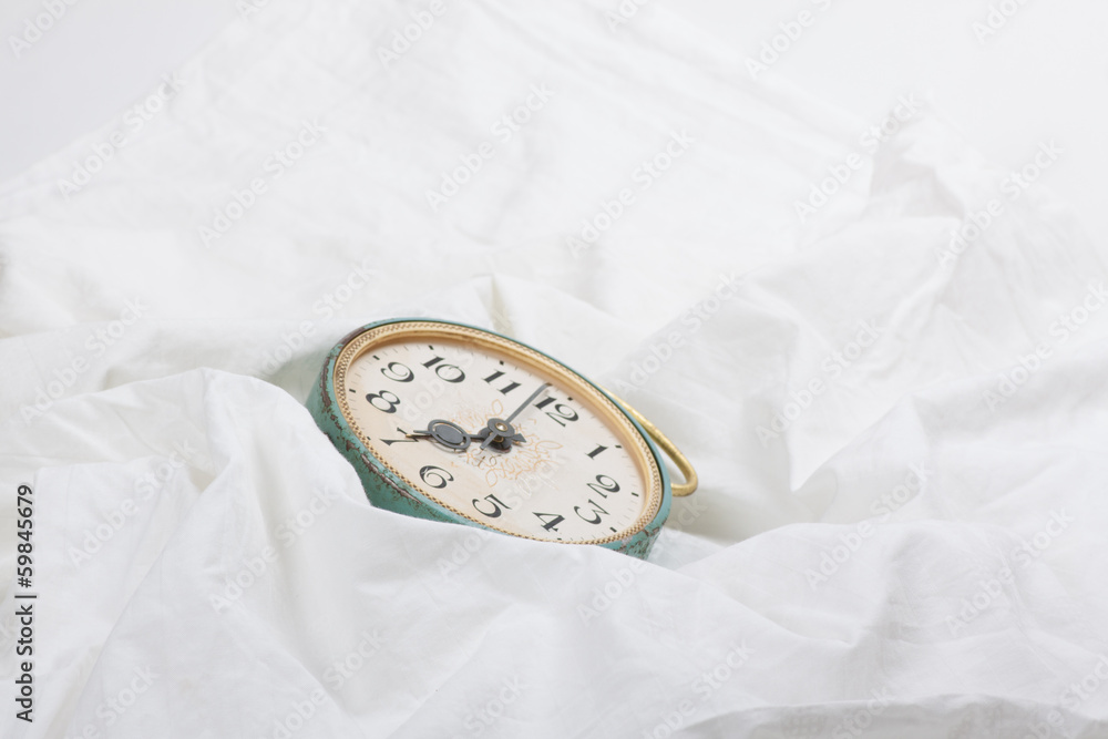 Wall mural alarm clock on the bed