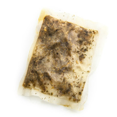 Used wet tea bags on a white background