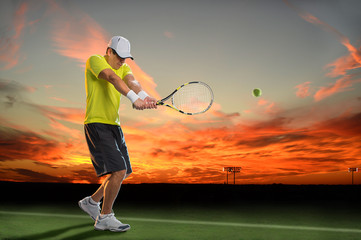 Fototapeta na wymiar Tennis Player at Sunset